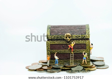 Miniature people : Group of tourist climbing the treasure chest use as prirate and way to success concept