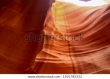 Ripples of color flow along the wall of Antelope Canyon located near Page Arizona. This sandstone slot canyon is a famous place for photographers. 