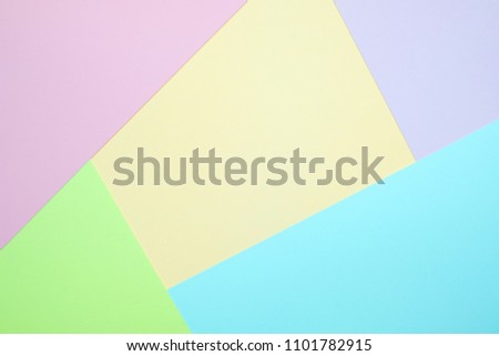 pastel colored paper top view, background texture, pink, purple, yellow, beige, green and blue