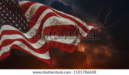 American flag waving in the wind Thunderstorm with lightning Multiple forks of lightning pierce the night sky