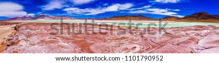 The amazing "Salar de Piedras Rojas" (Red Stones Saltlake) inside Atacama Desert at Chile in the Andes, an amazing and colorful landscape in the Chilean altiplano. From red to turquoise colors. Chile