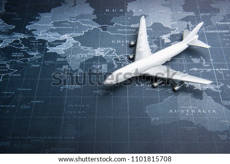 Passenger plane on the world map.Business transportation system concept Royalty-Free Stock Photo #1101815708