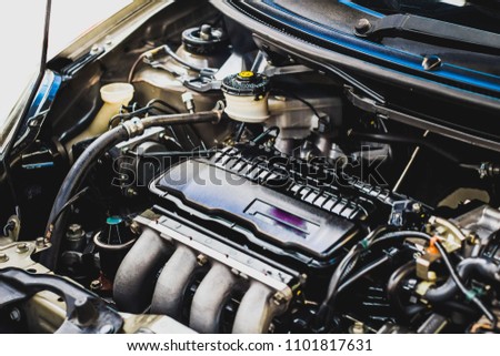 The components of the engine. And technology of modern car on white background , soft focus.