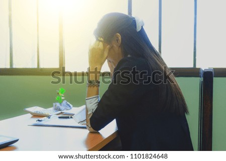 Young business woman stress in office. Checking on computer.