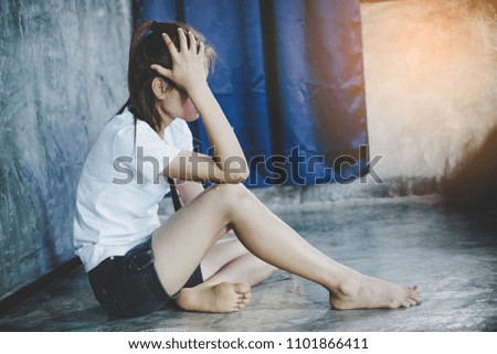 asian girl sad alone sitting in room 