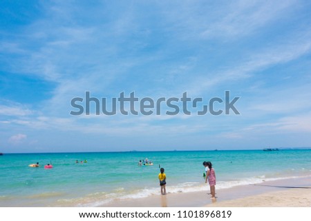 Children playing on the beach in vacation. Royalty high quality free stock image of children playing with friend on sand and beach in summer weather. The subject and background out of focus
