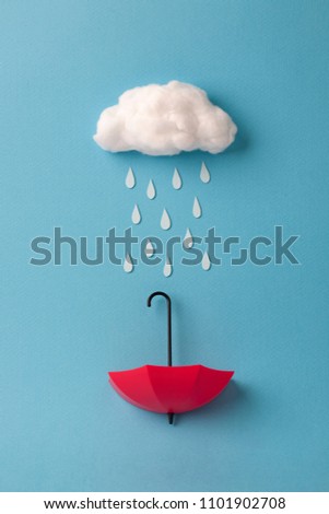 umbrella under the cloud on sky blue background
