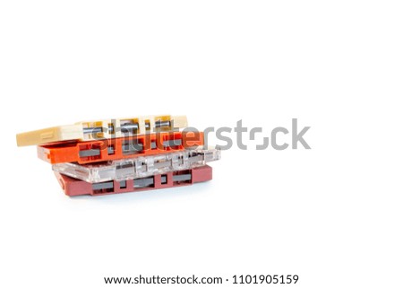 Side view of Cassette Tapes on white background with path.