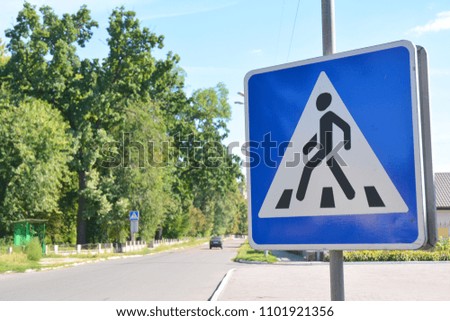 Pedestrian crossing sign on the street
