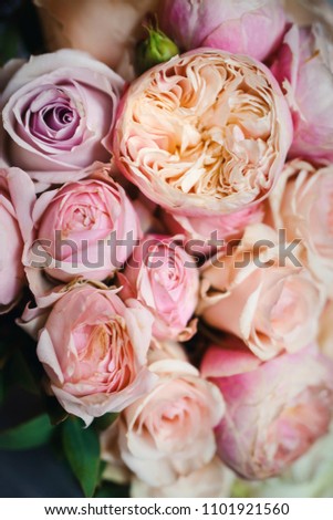 Beautiful close-up of a flower arrangement or bouquet with colorful flowers. Decoration of wedding reception or bridal bouquet. Macro shot flowers with selective focus