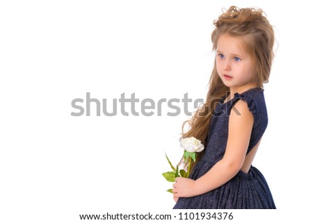 Beautiful little girl with a flower in her hands. The concept of beauty and fashion, happy childhood. Isolated on white background.