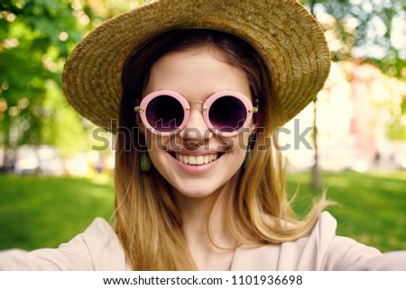happy woman in sunglasses with pink rim                           