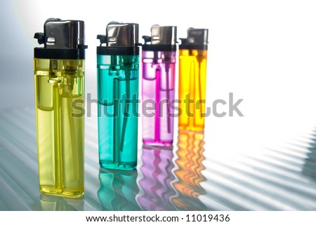 A colorful picture of a ordinary lighters, nicely lit.