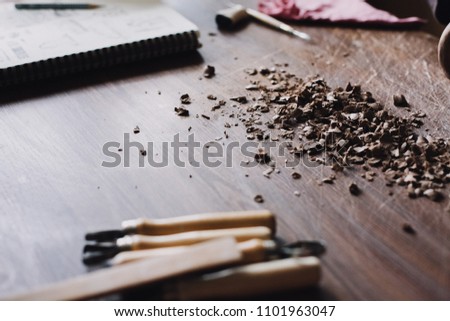 Cutting clay and tools on a wooden table