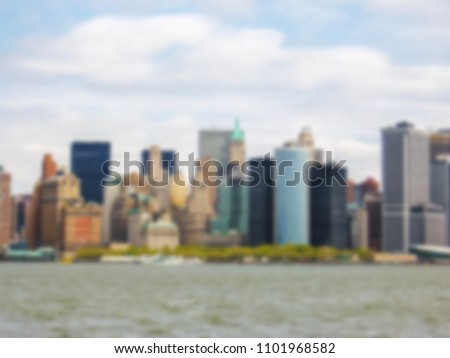 Defocused background with Manhattan Skyline with Empire State Building over Hudson River, New York City, United States. Intentionally blurred post production for bokeh effect