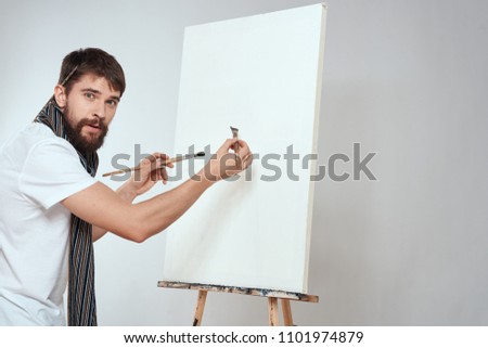   man painting on canvas art place free                             