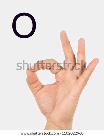 Alphabet in Russian sign language.  A symbol 16 from 33. A man's hand on a light background.