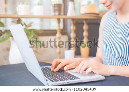 Business woman hand working with a laptop computer in the office.