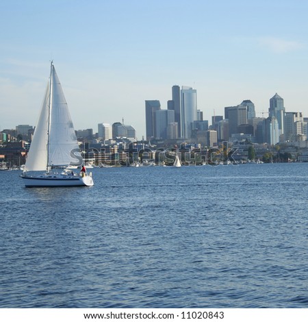 Sailing boat on lake union with Seattle skyline