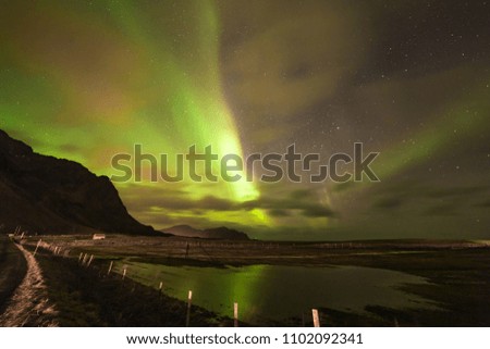 The Northern Lights over the village of Flakstad in Northern Norway's Lofoten Islands