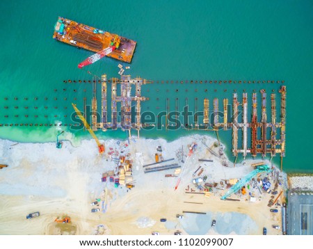 Construction site workers - aerial - Top View : for Marine works this picture for Construction Bert and Jetty, Construction Steel Pipe Pile used Piling Barge for driven pile.