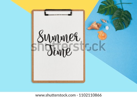 Summer Time text on white sheet on pastel color background