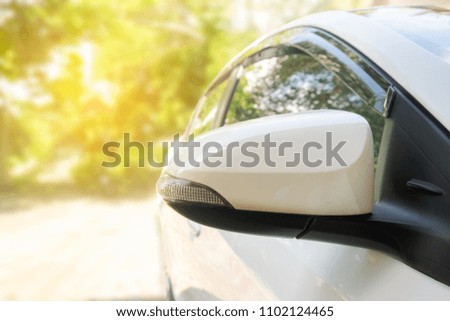 side car rear view mirror with sun light background
