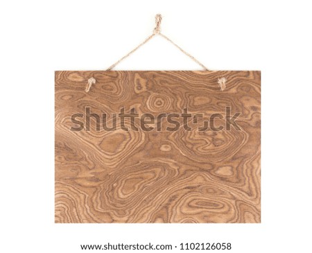 Labels made of natural wood, with a rope hanging on a white background, are empty.