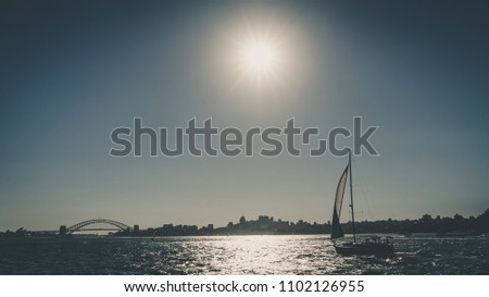 Boat and the Harbour Bridge in Sydney. Australia, June 2018.