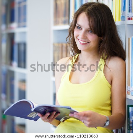 Pretty young college student in a library (shallow DOF; color toned image)