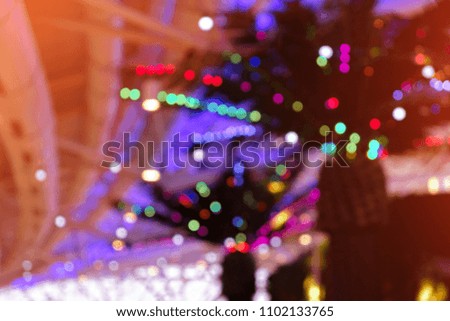 blurred abstract background with colorful lights bokeh. beautiful glowing blurred interior background with garlands. template for design
