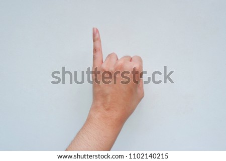 Closeup of girl left sign language meaning I, J or promise something with someone and hand upside down, hands clenched in a fist with little finger extended isolated on a white background