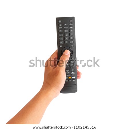 Hand holding remote control isolated on white background.