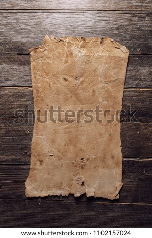 Blank paper on a wooden background