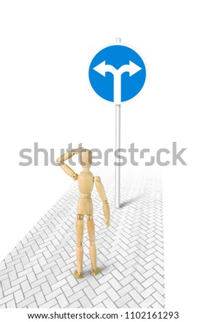 Man in bewilderment standing in front of Turn Left Or Right road sign. Conceptual image with a wooden puppet