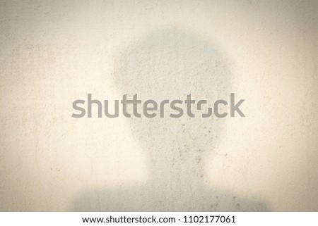 shadow of human head on abstract wall