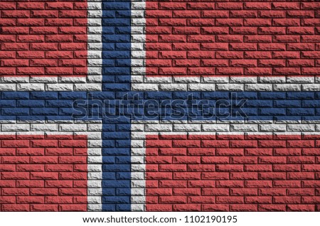 Norway flag is painted onto an old brick wall