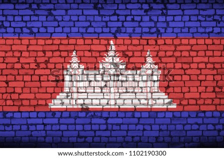 Cambodia flag is painted onto an old brick wall