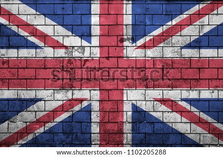 Great britain flag is painted onto an old brick wall