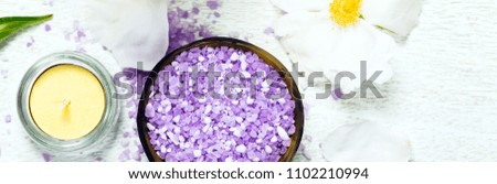 Top view of Spa Theme Objects with Purple Peony Rose Bath Salt Panoramic image. Selective focus.