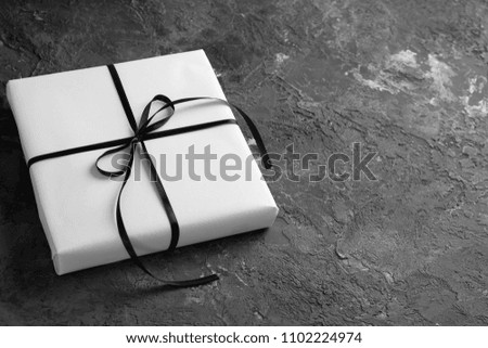 Beautiful gift box on grey textured background
