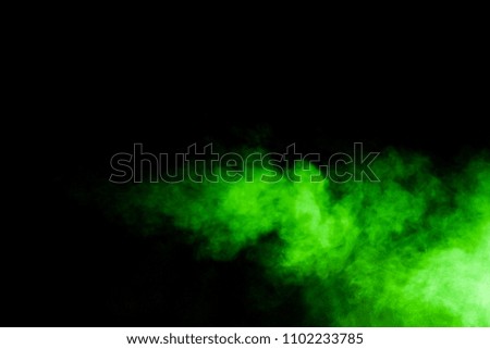 Green smoke on a black background.