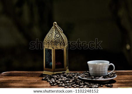 Vintage lantern with coffee and coffee beans. Ramadan mood .