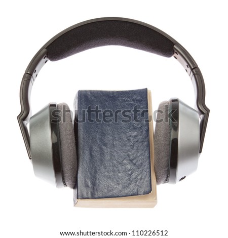 Wireless headphones and a book. On a white background.