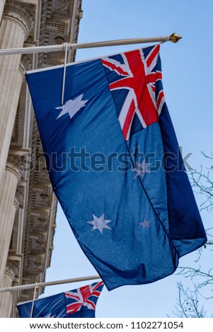 Australian flag flying on a flagpole.