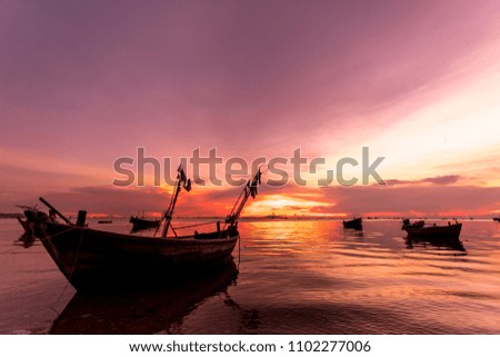 Boat for fisherman in the sea in silhouette sunset background