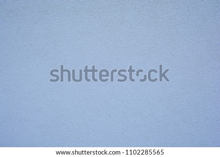 Blue textured wall of concrete