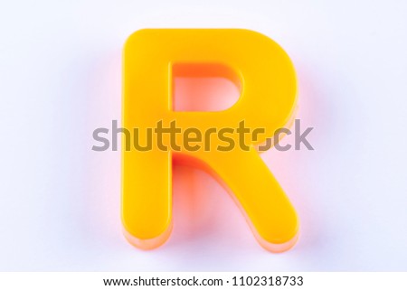 letter R uppercase alphabet isolated made of plastic on white background with shadows