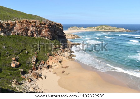 Wonderful landscape with a beach at the hiking trail at Robberg Nature Reserve in Plettenberg Bay, South Africa Royalty-Free Stock Photo #1102329935