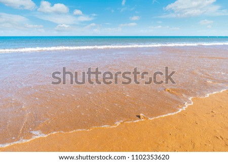 Sea beaches under the blue sky and white clouds